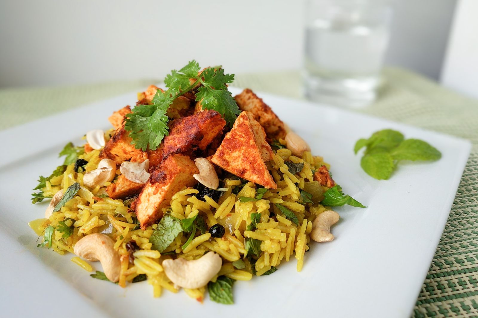 Tandoori tofu with spiced Indian rice, fresh herbs, and cashews