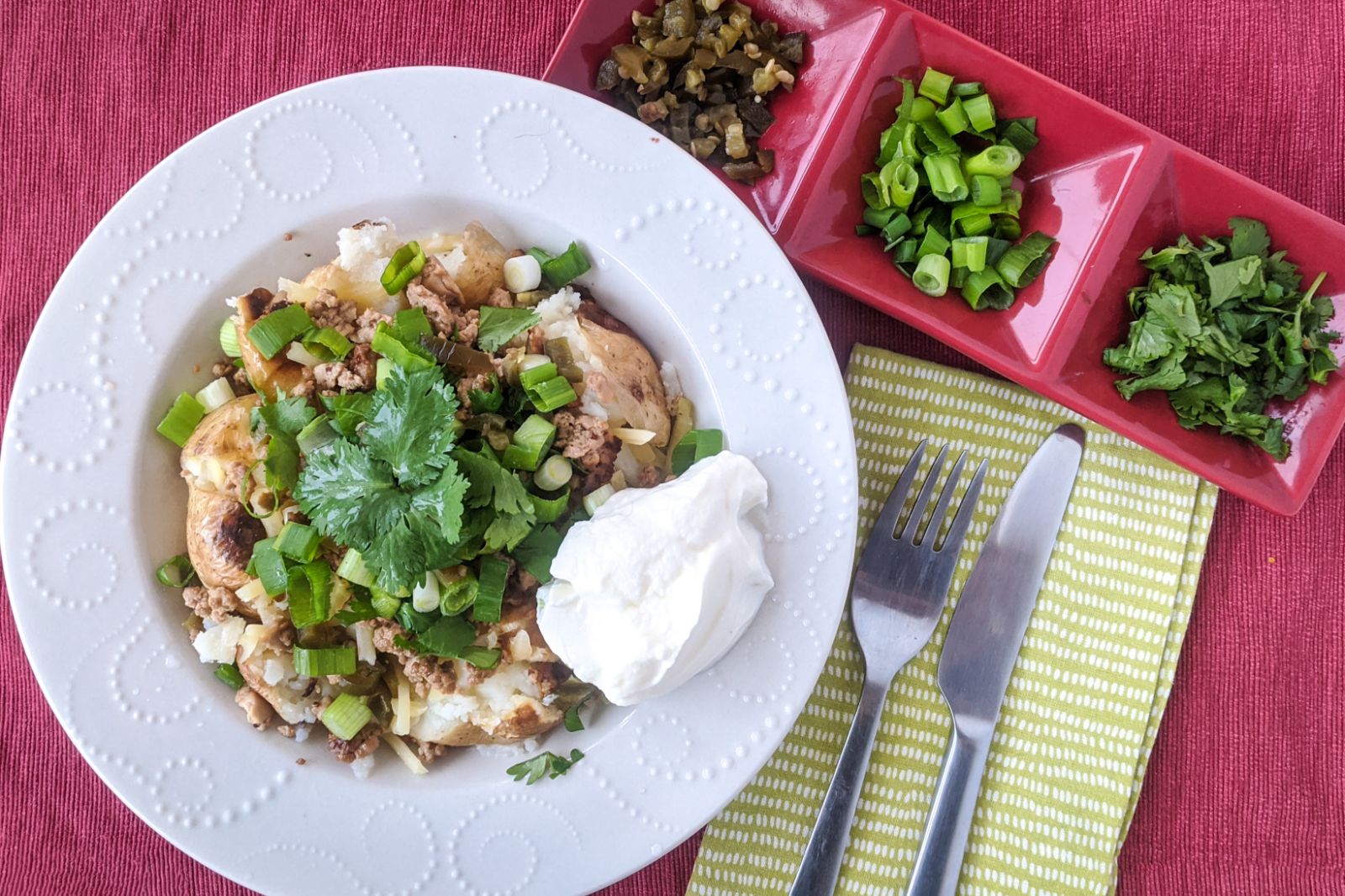 Cheesy baked potatoes with salty tofu, jalapenos, and coriander